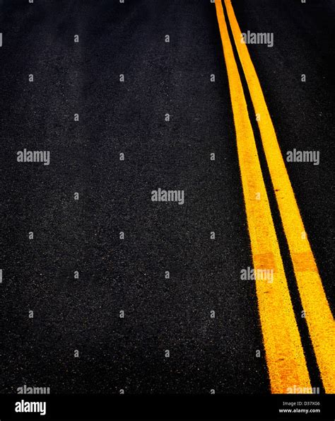 Road with painted double yellow lines Stock Photo - Alamy