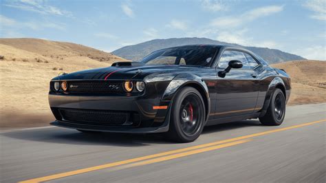 https://www.motortrend.com/uploads/2023/08/001-2023-Dodge-Challenger-Scat-Pack-Shakedown-front-three-quarters-in-action.jpg
