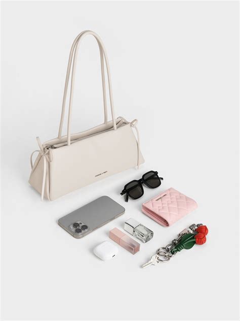 Meringue White Hazel Bow Elongated Trapeze Shoulder Bag - Meringue ...