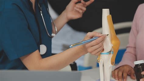 Human cruciate ligament injury treatment concept. Orthopedist showing ...