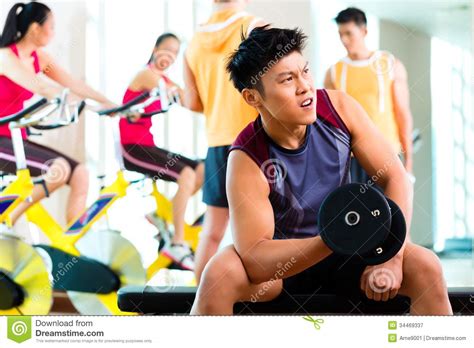Asian People Exercising Sport For Fitness In Gym Stock Image - Image of asia, healthy: 34469337