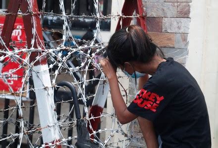 A released prisoner, right, is welcomed by her colleague after she was released from Insein Prison Sunday, Jan. 4, 2026, in Yangon, Myanmar. (AP Photo/Thein Zaw)