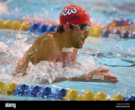Michael Phelps swims the breaststroke during practice laps at the ...