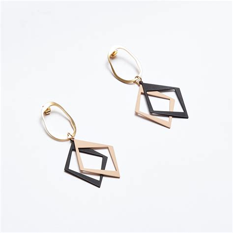 Buy Black Nude Dual Tone Diamond Drop Earrings