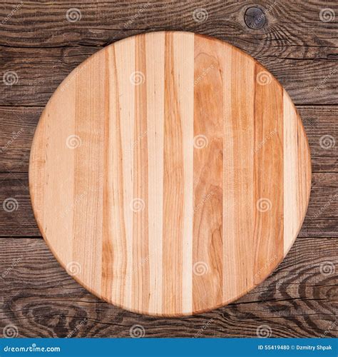 Round Cutting Board on an Old Table Stock Photo - Image of food, macro ...