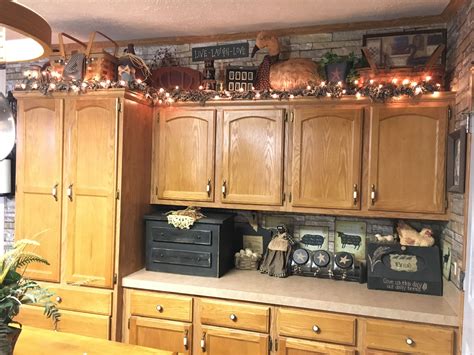 Primitive kitchen decor and above cabinets decor | Kitchen cabinets ...