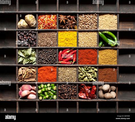 Indian cooking spices in an old wooden tray. Flat lay photography from ...
