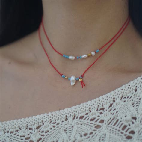 Image result for Red String Designs