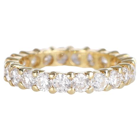 18K White Gold Eternity Ring with Trapezoid, Princess, and Brilliant ...