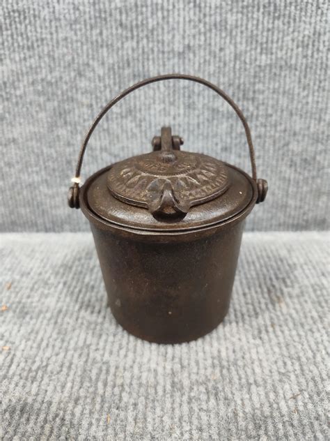 At Auction: Fanner Mfg Co Cast Iron Melting Pot