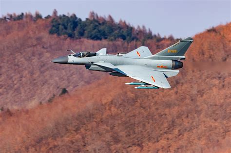 J-10B fighter jets fly through valley - Ministry of National Defense