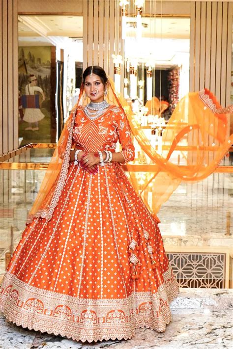 THE BRIDAL BLOOM ORANGE COLOR LEHENGA