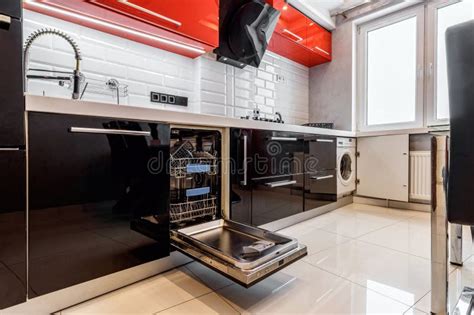 Modern Half Open Empty Dishwasher in a Modern Kitchen Stock Image ...
