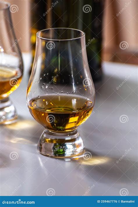 Tasting of Whiskey, Tulip-shaped Tasting Glasses with Dram of Scotch ...