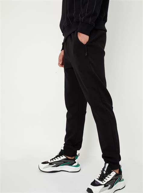 Buy Men Solid Athleisure Joggers Online at just Rs. 1199.0 ...