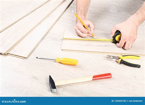 Man Installing Laminate Flooring Stock Photo - Image of beige ...