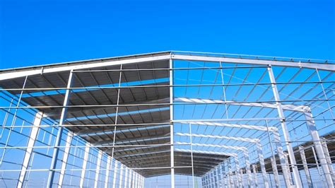 Industrial building structure during install corrugated steel roofing ...