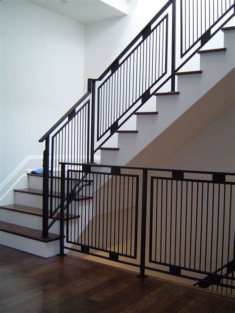 White walls and black railing. "www.thesteelworks.ca". | Stair railing ...