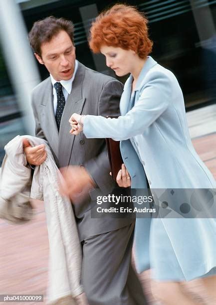 Two Business People Walking Side by Side 的图像结果