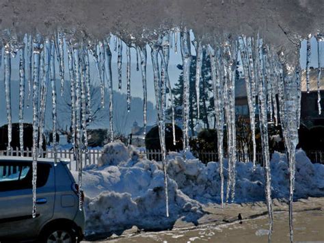 Disruption in daily life - Tourists flock to frozen waterfall in ...