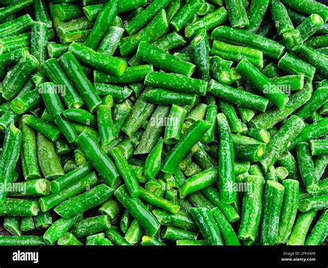 Green frozen string beans background. Cut green pods Stock Photo - Alamy