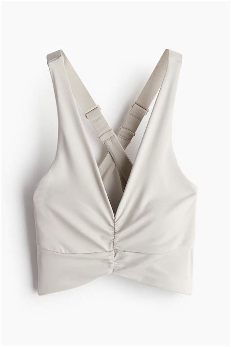 Light Support Sports bra with SoftMove™ - Light beige - Ladies | H&M IN