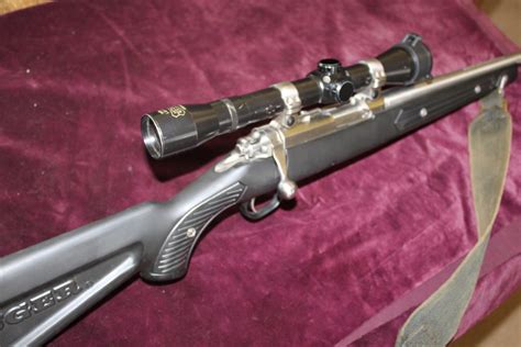 .22 bolt action rifle by Ruger with Sound Mod and Scope