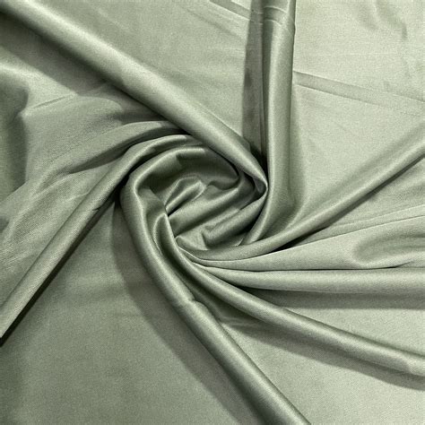 Buy Sage Green Solid Lycra Dyed Fabric Online – TradeUNO Fabrics