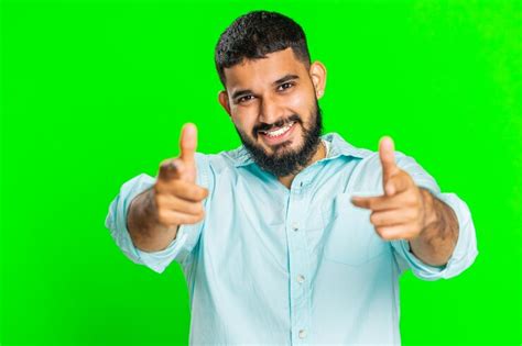 Happy indian smiling man pointing finger to camera making winner choice ...