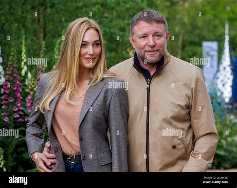 Film Director, Producer, screenwriter and businessman, Guy Ritchie with his wife, Jacqui Ainsley ...