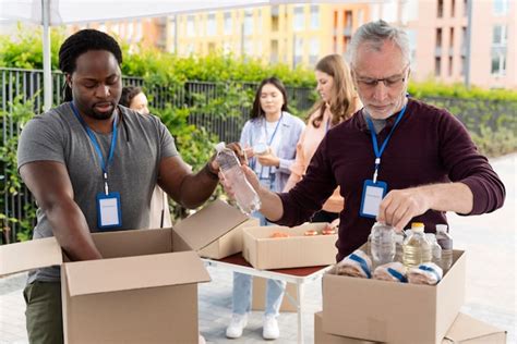 Group of people volunteering at a foodbank | Free Photo