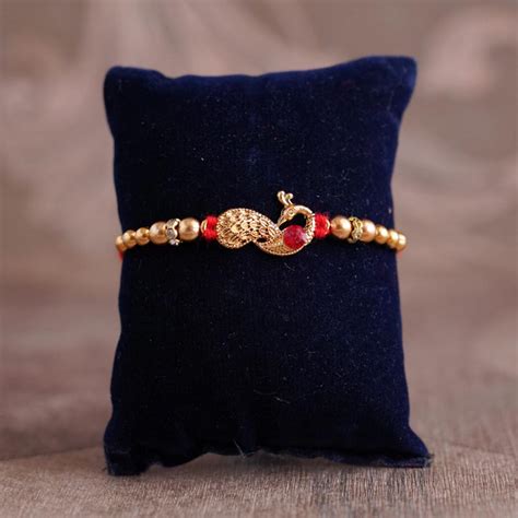 Send Peacock Rakhi With Mug and Chocolates Online | Rakhibazaar.com