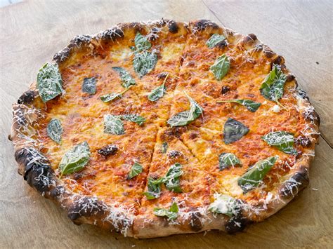 A.K. Pizza is hard to get—and even harder to beat - Review - Seattle ...