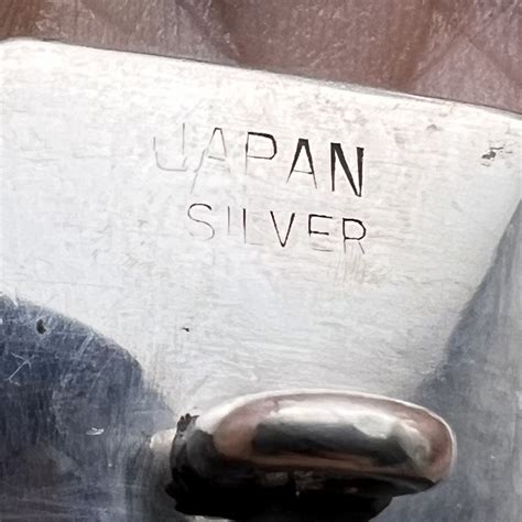 Lot Detail - Japanese Arita porcelain button of an orchid set in ...