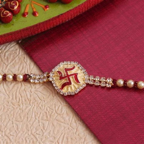 Send Golden Swastika Rakhi Online