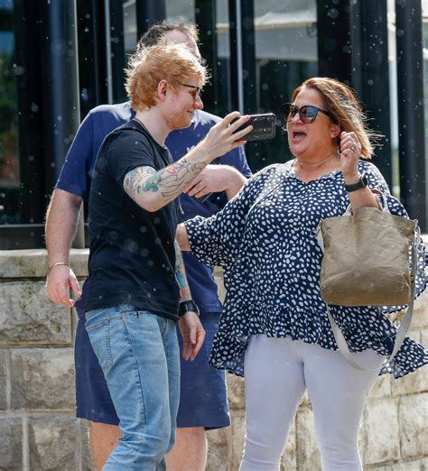 Ed Sheeran and wife Cherry step out in rain with baby girl