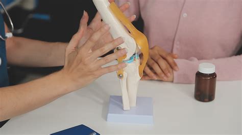 Human cruciate ligament injury treatment concept. Orthopedist showing ...