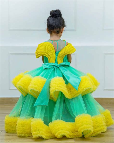 Aqua green and light mango yellow layered frilled gown with stylish pi ...