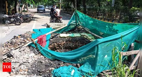Month-old road cave-in in Noida awaits repairs, vehicles forced to take ...