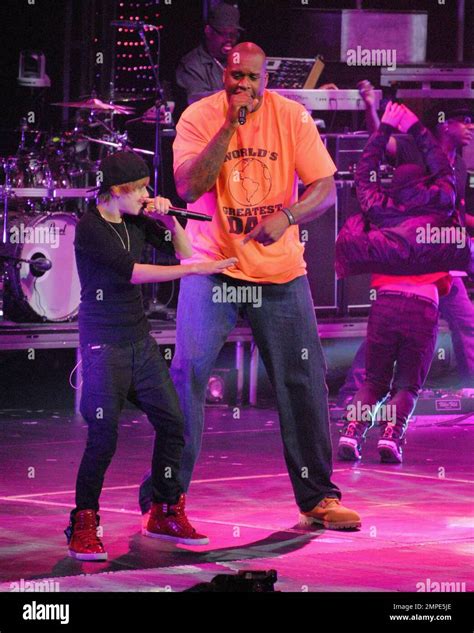Teen heartthrob Justin Bieber and 7' 1'' tall NBA star Shaquille O'Neal perform an unlikely ...