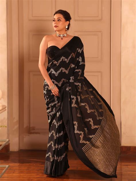 KAVVYA BLACK CRAPE SAREE WITH ALL OVER GOLDEN ZARI
