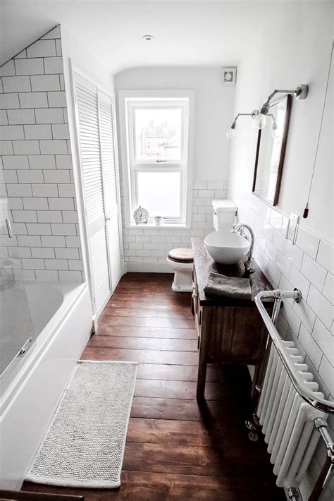 White Subway Tile Wood Floor Bathroom - Home Alqu