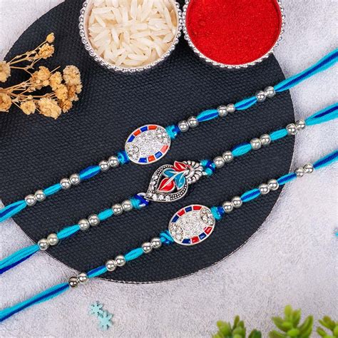 Send Stunning Set of Three Silver Rakhi for Brothers Online ...