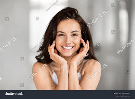 Стоковая фотография 2453275621: Joyful Woman Bright Smile Holding Her ...
