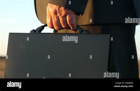 Man in a Business Suit in a Mall Parking Lot 的图像结果