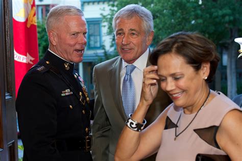 Defense Secretary Chuck Hagel, center, and his wife, Lilibet, speak ...