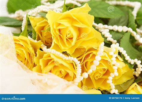 Bouquet of Yellow Roses and Pearls on White Dress Stock Photo - Image ...