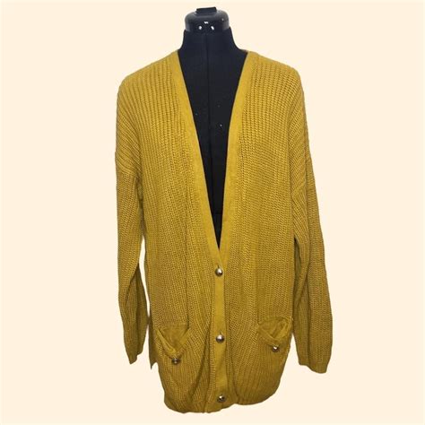 Yellow knitted cardigan with pockets and chunky... - Depop