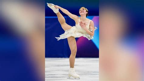 Feb 19, 2026; Milan, Italy; Alysa Liu of the United States celebrates with the gold medal in the women's free skate during the Milano Cortina 2026 Olympic Winter Games at Milano Ice Skating Arena. Mandatory Credit: James Lang-Imagn Images