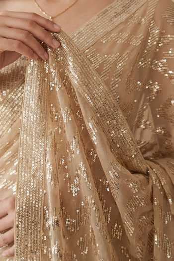 Buy Gold Georgette Bandeau Neck Sequin Embellished Saree And Unstitched ...